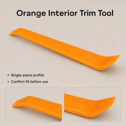 Orange single-piece trim removal tool with visible end profiles