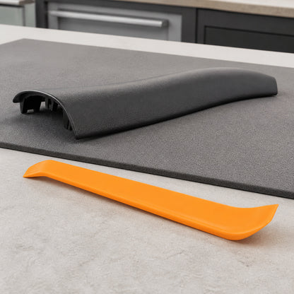 Orange trim removal pry tool beside a neutral trim sample